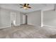 Inviting main bedroom with carpet, access to a walk-in closet and ensuite bath at 1138 School Side Dr, Lithonia, GA 30058