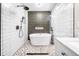 Modern bathroom featuring a standalone tub, subway tile, and glass shower at 3274 Ridgecrest Se Rd, Smyrna, GA 30080