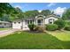 Charming single-story home featuring a well-manicured lawn and cozy front porch at 3274 Ridgecrest Se Rd, Smyrna, GA 30080