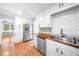 Modern kitchen featuring white cabinets, stainless steel appliances, and butcher block countertop at 3274 Ridgecrest Se Rd, Smyrna, GA 30080
