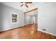 Open living room with hardwood floors and exposed beam at 3274 Ridgecrest Se Rd, Smyrna, GA 30080