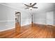 Open living area showing hardwood floors and access to the kitchen and hallway at 3274 Ridgecrest Se Rd, Smyrna, GA 30080