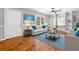 Cozy living room featuring hardwood floors, built-in shelving, and natural light at 3274 Ridgecrest Se Rd, Smyrna, GA 30080