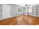 Bright living room showing hardwood floors, a ceiling fan, and bright walls at 3274 Ridgecrest Se Rd, Smyrna, GA 30080