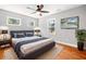 Bedroom with hardwood floors, a ceiling fan and a wall mounted television at 3274 Ridgecrest Se Rd, Smyrna, GA 30080
