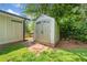Plastic storage shed in a lush, green backyard at 3274 Ridgecrest Se Rd, Smyrna, GA 30080