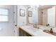 Bathroom featuring a single sink vanity, decorative framed art, and shower at 3290 Cherry Oak Ln, Cumming, GA 30041