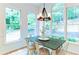 Charming dining area with natural light, rustic chandelier, and hardwood floors at 3290 Cherry Oak Ln, Cumming, GA 30041