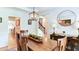 Bright dining room with a wood table, stylish decor, and easy access to the rest of the home at 3290 Cherry Oak Ln, Cumming, GA 30041