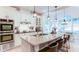 Kitchen with an island, seating, stainless appliances, stone countertops, and eat-in dining at 3290 Cherry Oak Ln, Cumming, GA 30041