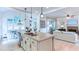 Modern kitchen featuring a large island with granite countertops, stainless steel appliances, and an open floor plan at 3290 Cherry Oak Ln, Cumming, GA 30041