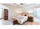 Spacious main bedroom with a tray ceiling, hardwoods, and ensuite bath access at 3290 Cherry Oak Ln, Cumming, GA 30041