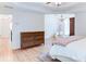 Spacious main bedroom with a tray ceiling, hardwood floors, and seating area at 3290 Cherry Oak Ln, Cumming, GA 30041
