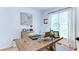 Well-lit home office featuring a rustic wooden desk, perfect for remote work or study at 3290 Cherry Oak Ln, Cumming, GA 30041