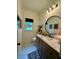 Stylish powder room with shiplap walls, modern lighting, round mirror, marble countertop, and beautiful finishes at 3532 W Hampton Nw Dr, Marietta, GA 30064