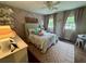 Charming bedroom with a plush bed, patterned rug, and decorative wall accents at 3532 W Hampton Nw Dr, Marietta, GA 30064