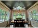 Sunlit dining room with large windows offering picturesque backyard views, perfect for Gathering gatherings and entertaining guests at 3532 W Hampton Nw Dr, Marietta, GA 30064