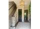 Inviting entryway with staircase, decorative rug, and elegant lighting, perfect for greeting guests at 3532 W Hampton Nw Dr, Marietta, GA 30064