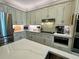 Bright kitchen featuring sleek appliances, ample counter space, and stylish cabinetry with under cabinet lighting at 3532 W Hampton Nw Dr, Marietta, GA 30064