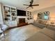 Inviting living room featuring custom built-ins, brick fireplace, and comfortable seating, perfect for relaxing and entertaining at 3532 W Hampton Nw Dr, Marietta, GA 30064