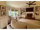 Cozy living room featuring built-in shelving, fireplace, and comfortable seating with ample natural light at 3532 W Hampton Nw Dr, Marietta, GA 30064