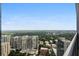 Breathtaking city views from the balcony, showcasing the skyline and greenery on a clear, sunny day at 1065 Peachtree Ne St # 3505, Atlanta, GA 30309