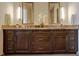 Luxurious bathroom featuring dual vanities with decorative mirrors and ample cabinet space at 1065 Peachtree Ne St # 3505, Atlanta, GA 30309