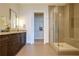 Elegant bathroom with a glass-enclosed shower, dual vanity, and walk-in closet at 1065 Peachtree Ne St # 3505, Atlanta, GA 30309
