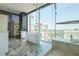 Modern bathroom with a soaking tub overlooking the city, a glass shower, and marble countertops at 1065 Peachtree Ne St # 3505, Atlanta, GA 30309