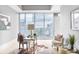 Bright bedroom featuring a modern desk, comfortable seating, and city views at 1065 Peachtree Ne St # 3505, Atlanta, GA 30309