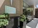 Welcoming building entrance with modern architecture and lush greenery at 1065 Peachtree Ne St # 3505, Atlanta, GA 30309