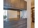 Modern walk-in closet with custom shelving, drawers, cabinets, and mirror at 1065 Peachtree Ne St # 3505, Atlanta, GA 30309
