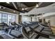 Well-equipped fitness center with treadmills and large windows for a bright workout space at 1065 Peachtree Ne St # 3505, Atlanta, GA 30309