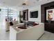 Contemporary living room with stylish furnishings, city views, and a decorative accent wall at 1065 Peachtree Ne St # 3505, Atlanta, GA 30309