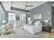 Spacious main bedroom featuring city views from floor-to-ceiling windows, a ceiling fan, and modern decor at 1065 Peachtree Ne St # 3505, Atlanta, GA 30309