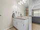 Well-lit bathroom vanity featuring granite counters and stylish fixtures, offers a serene and functional space at 2990 Cove Crossing Dr, Lawrenceville, GA 30045