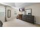 Neutral carpeted bedroom featuring lots of natural light, seating and large dressers at 2990 Cove Crossing Dr, Lawrenceville, GA 30045