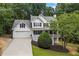 Charming two-story traditional home with a well-manicured lawn and attached two-car garage at 2990 Cove Crossing Dr, Lawrenceville, GA 30045