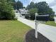Charming two-story home with a welcoming front porch and well-maintained landscaping at 2990 Cove Crossing Dr, Lawrenceville, GA 30045