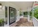 Inviting front porch with a 'Welcome' mat, offering a warm entry to this charming home with garden views at 2990 Cove Crossing Dr, Lawrenceville, GA 30045
