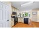 Bright kitchen features granite counters, stainless appliances, and a breakfast nook with backyard view at 2990 Cove Crossing Dr, Lawrenceville, GA 30045