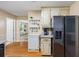 This kitchen features stainless steel appliances, wooden floors, granite countertops, and an open layout at 2990 Cove Crossing Dr, Lawrenceville, GA 30045