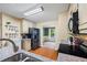 Kitchen features stainless steel appliances, wooden floors, granite countertops, and an open layout at 2990 Cove Crossing Dr, Lawrenceville, GA 30045