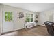 Cozy living room area with door to the outside, perfect for indoor-outdoor living at 2990 Cove Crossing Dr, Lawrenceville, GA 30045