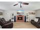 Comfortable living room with a brick fireplace and modern furnishings at 2990 Cove Crossing Dr, Lawrenceville, GA 30045