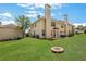 A view of the backyard with a lush green lawn, offering a serene outdoor space for relaxation and recreation at 417 Red Coat Ln, Woodstock, GA 30188