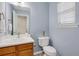 Bathroom featuring a single sink vanity and powder blue walls at 417 Red Coat Ln, Woodstock, GA 30188