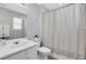 Bathroom featuring shower/tub with curtain and vanity with sink at 417 Red Coat Ln, Woodstock, GA 30188