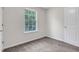 This cozy bedroom boasts neutral carpeting and a window that bathes the room in natural light at 417 Red Coat Ln, Woodstock, GA 30188