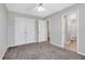 Spacious bedroom featuring neutral paint, closet, and view to attached bathroom at 417 Red Coat Ln, Woodstock, GA 30188